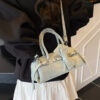 02a5d879-c92b-4a27-9d1a-bc01f1a9b986-Max-Origin.jpg Denim Bow Accent Crossbody Bag