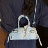 297dd488-94f5-4e1c-9670-fa6c862a18e4-Max-Origin.jpg Denim Bow Accent Crossbody Bag