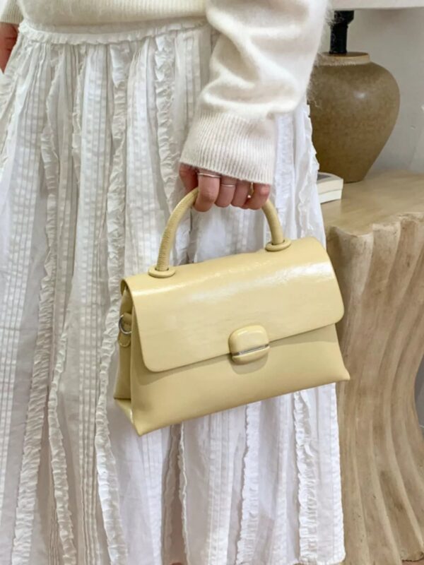 2d9a0bb6-3e9a-4a44-8aaf-eb7422dc6d6a-Max-Origin.jpg Top-Handle Crossbody Bag