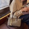 4a8f8601-f886-4616-ab86-8c3051564ac8-Max-Origin.jpg Woven Crossbody Bag with Gold Chain Accents