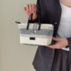 4ac27296-404c-479f-b210-40174ba0383d-Max-Origin.jpg Striped Canvas Crossbody Bag