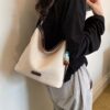 Casual Shoulder Bag with Decorative Charm