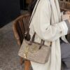 4dd02fca-5dd0-4a23-bd77-7519d744ffd1-Max-Origin.jpg Woven Crossbody Bag with Gold Chain Accents