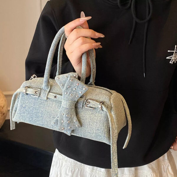 7af3ca39-8736-4b02-b72b-0c0cb5af98bc-Max-Origin.jpg Denim Bow Accent Crossbody Bag