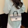 994e3f1d-ae64-4290-bf31-86bb2dc81987-Max-Origin.jpg Striped Canvas Crossbody Bag