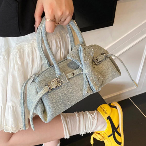 a5660870-2f4b-4f34-b5de-c050f4119573-Max-Origin.jpg Denim Bow Accent Crossbody Bag