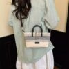 f5262d67-434a-4e15-af04-ba5784c1327b-Max-Origin.jpg Striped Canvas Crossbody Bag